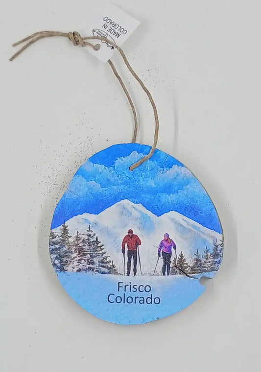 Wooden Ornament With A Skiing Couple and Beautiful Mountain Scenery Round The Mountain Gift Shop